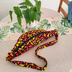 Sac banane en tissu wax motif pétales jaune orange et rouge